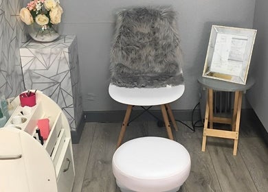 Cozy seating area at Rock Candy Beauty, Louth, England, GB with plush chair and decor.