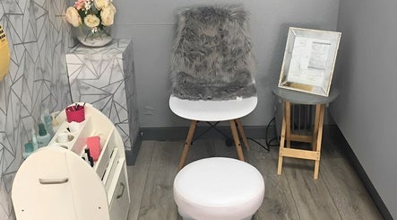 Cozy seating area at Rock Candy Beauty, Louth, England, GB with plush chair and decor.