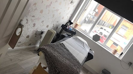 Serene treatment room at Rock Candy Beauty in Louth, England, GB, with calming decor and natural light.