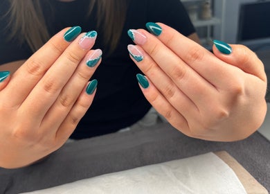 Elegant manicure displayed at Rock Candy Beauty, Louth, England, GB with teal and pink nail art.