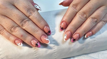 Stylish Halloween nail design at Rock Candy Beauty, Louth, England, GB. Pink nails with ghost graphics.