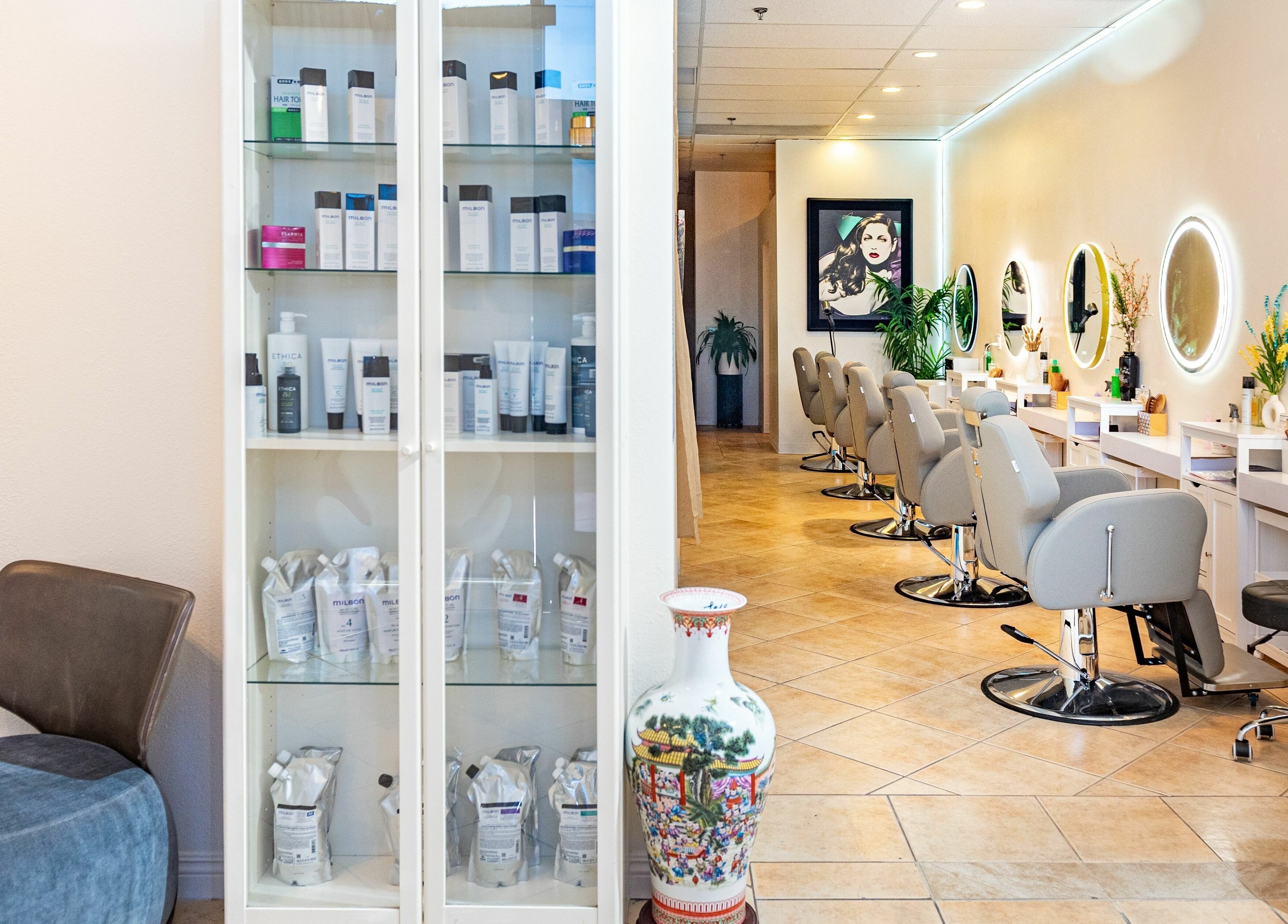 Modern salon interior of Siyu Hair SPA in Henderson, Nevada, US, featuring stylish chairs and beauty products.