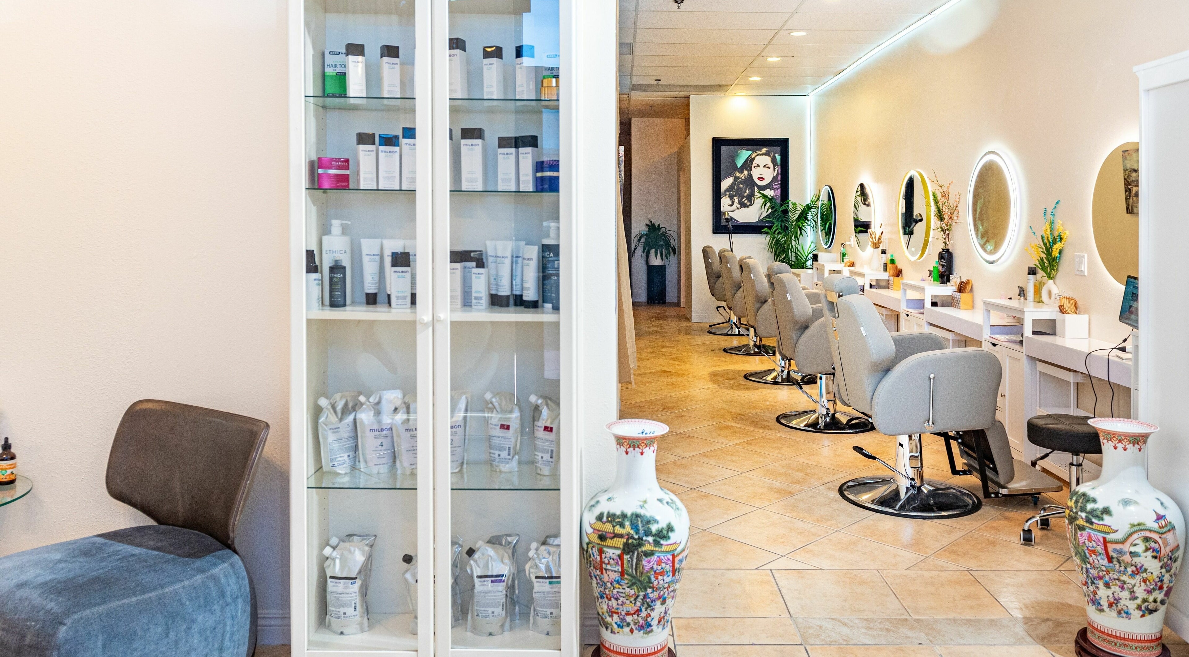 Modern salon interior of Siyu Hair SPA in Henderson, Nevada, US, featuring stylish chairs and beauty products.