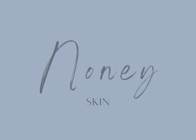 Noney Skin's elegant logo on a serene blue background in Glasgow, Scotland, GB.