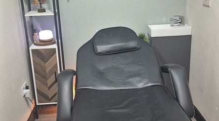 Relaxing treatment room at Holistic Healing Hands, Lurgan, Northern Ireland, GB. Features a modern massage bed.