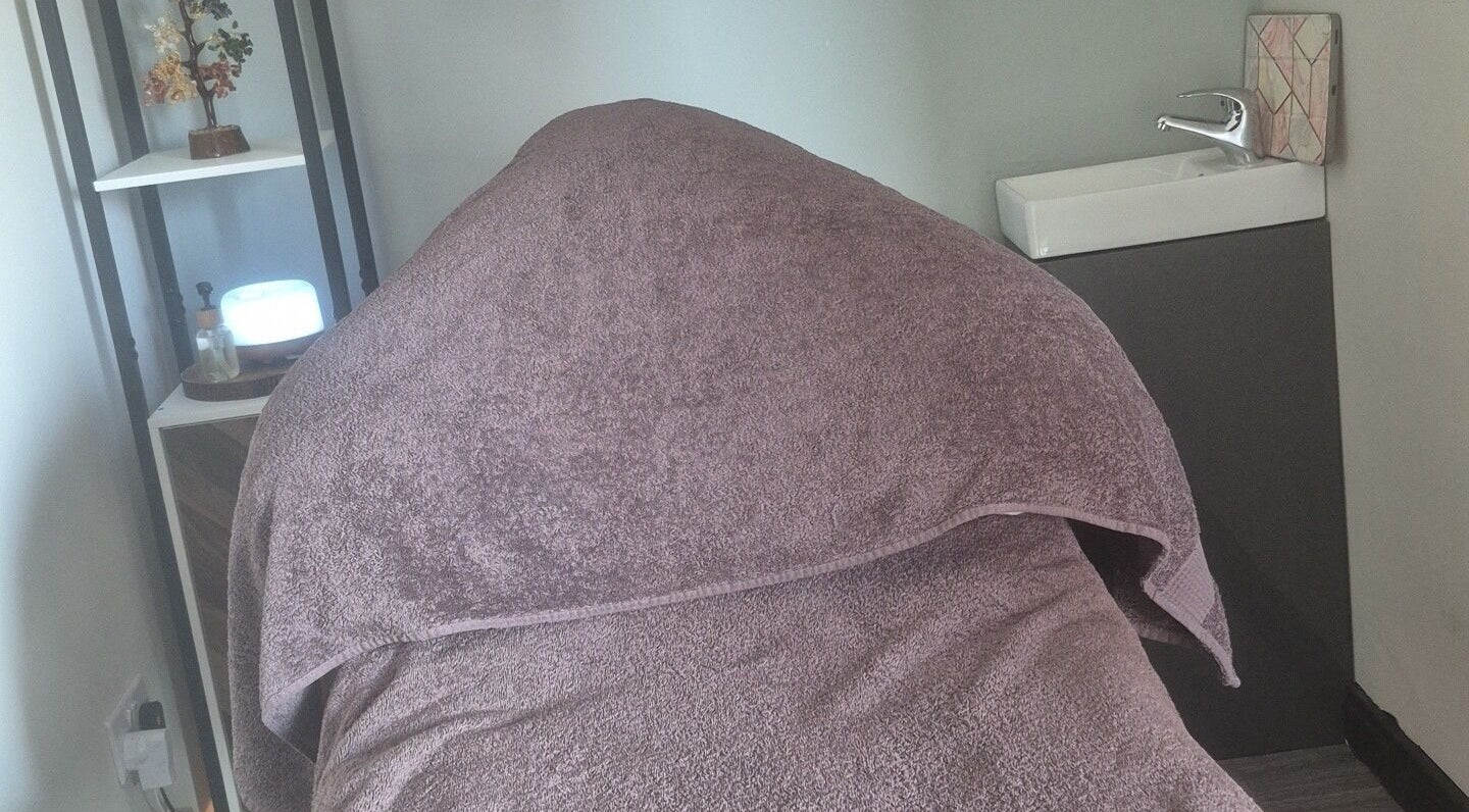 Cozy massage bed at Holistic Healing Hands, Lurgan, Northern Ireland, GB, offering a tranquil retreat.