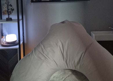 Tranquil massage room at Holistic Healing Hands, Lurgan, Northern Ireland, GB with calming decor and soft lighting.