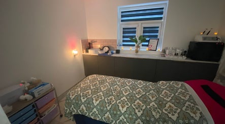 Relaxing treatment room at Namaste Swindon Beauty Services by Reema, Swindon, England, GB, with calming decor.