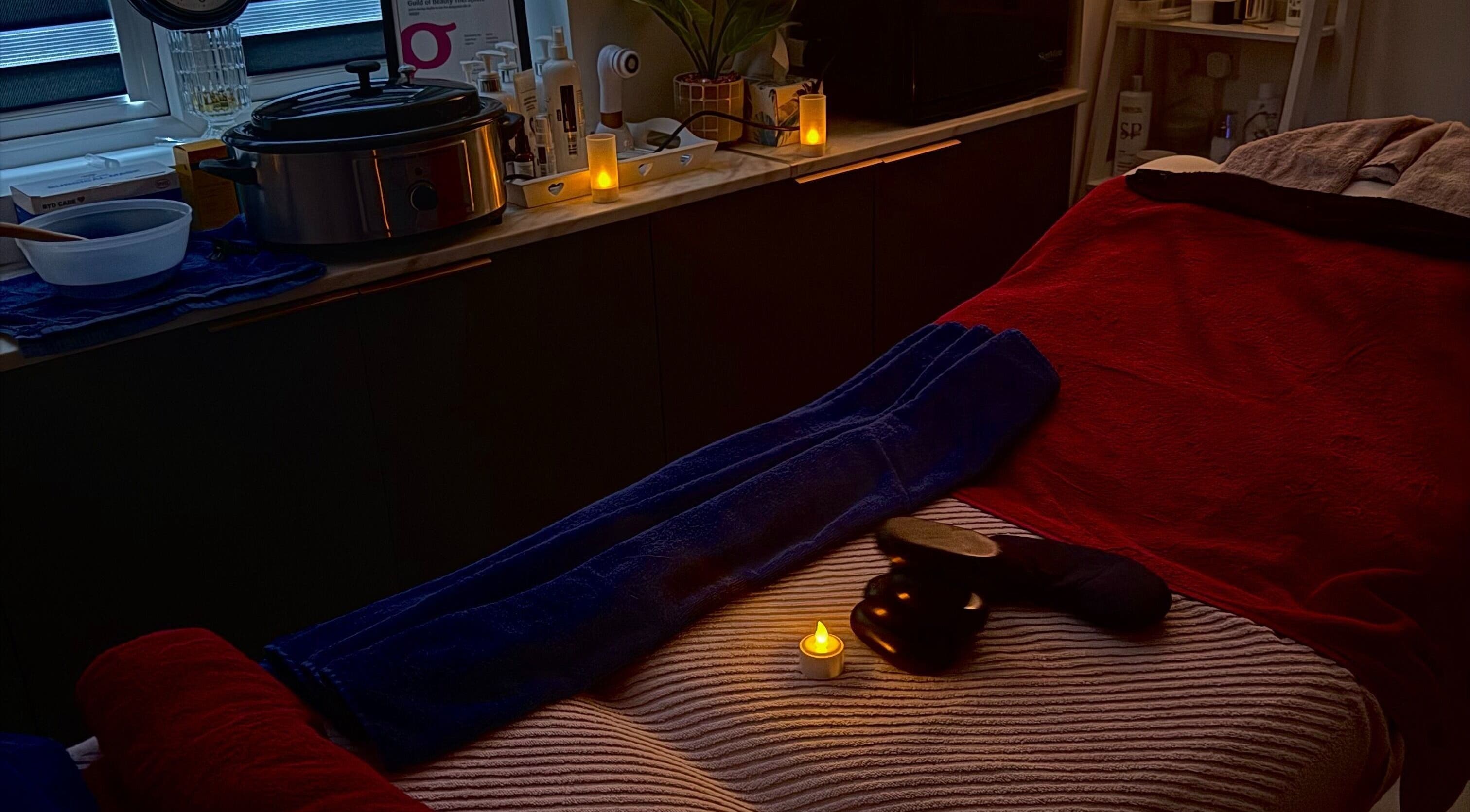 Relaxing spa setup at Namaste Swindon Beauty Services by Reema in Swindon, England, GB. Tranquil ambiance with candles.