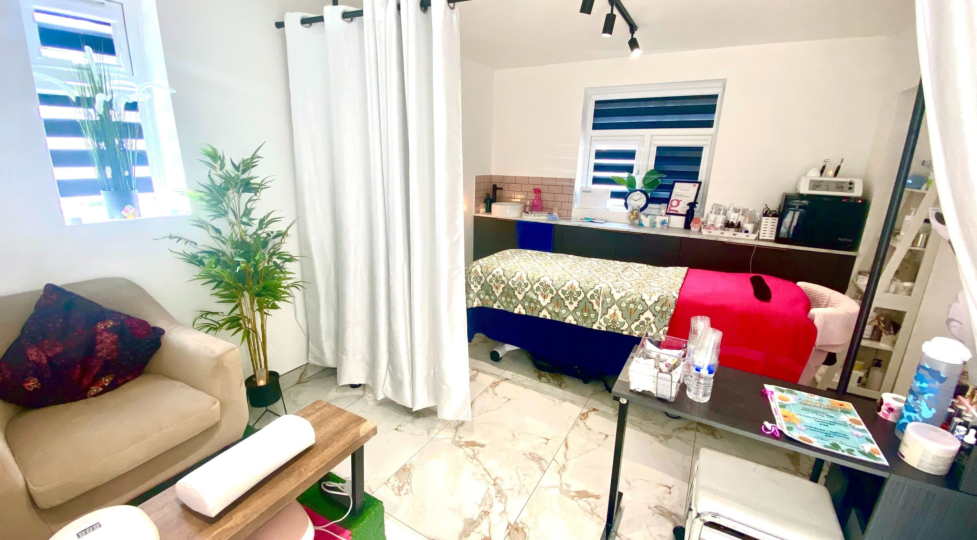 Cozy treatment room at Namaste Swindon Beauty Services by Reema, Swindon, England, GB. Elegant decor and comfortable seating.