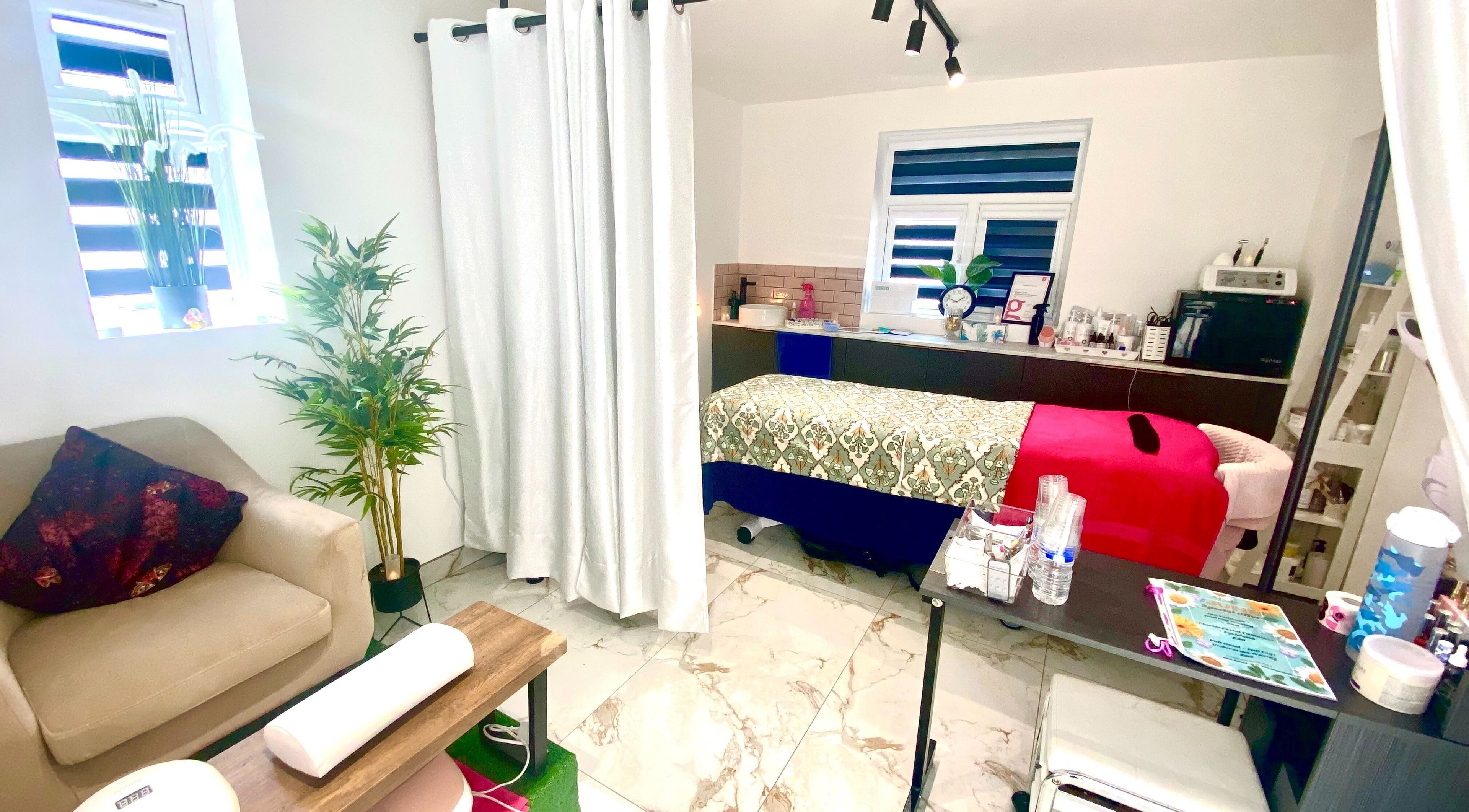 Cozy treatment room at Namaste Swindon Beauty Services by Reema, Swindon, England, GB. Elegant decor and comfortable seating.