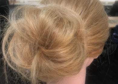 Elegant updo hairstyle at Moss Hair Artistry located in Neutral Bay, New South Wales, AU.