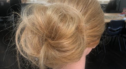Elegant updo hairstyle at Moss Hair Artistry located in Neutral Bay, New South Wales, AU.