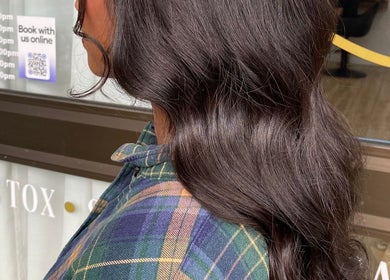 Glossy brunette waves styled at Moss Hair Artistry, Neutral Bay, New South Wales, AU.