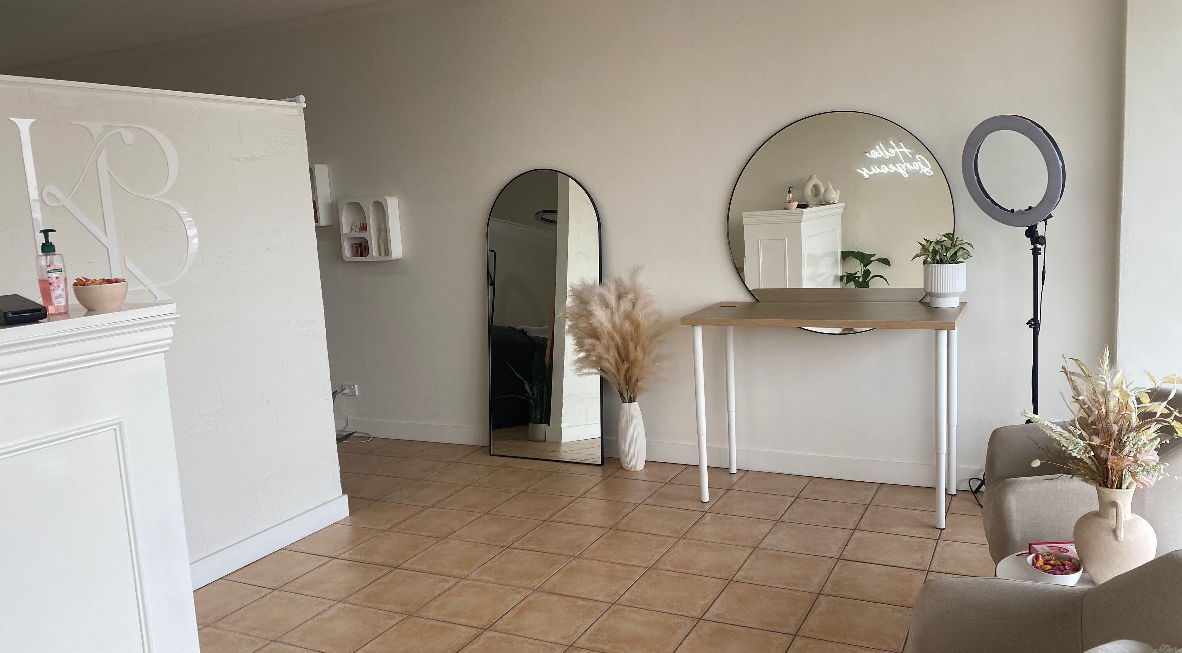 Modern interior of Kelaya Beauty in North Brighton, SA, AU, featuring elegant mirrors and serene decor.