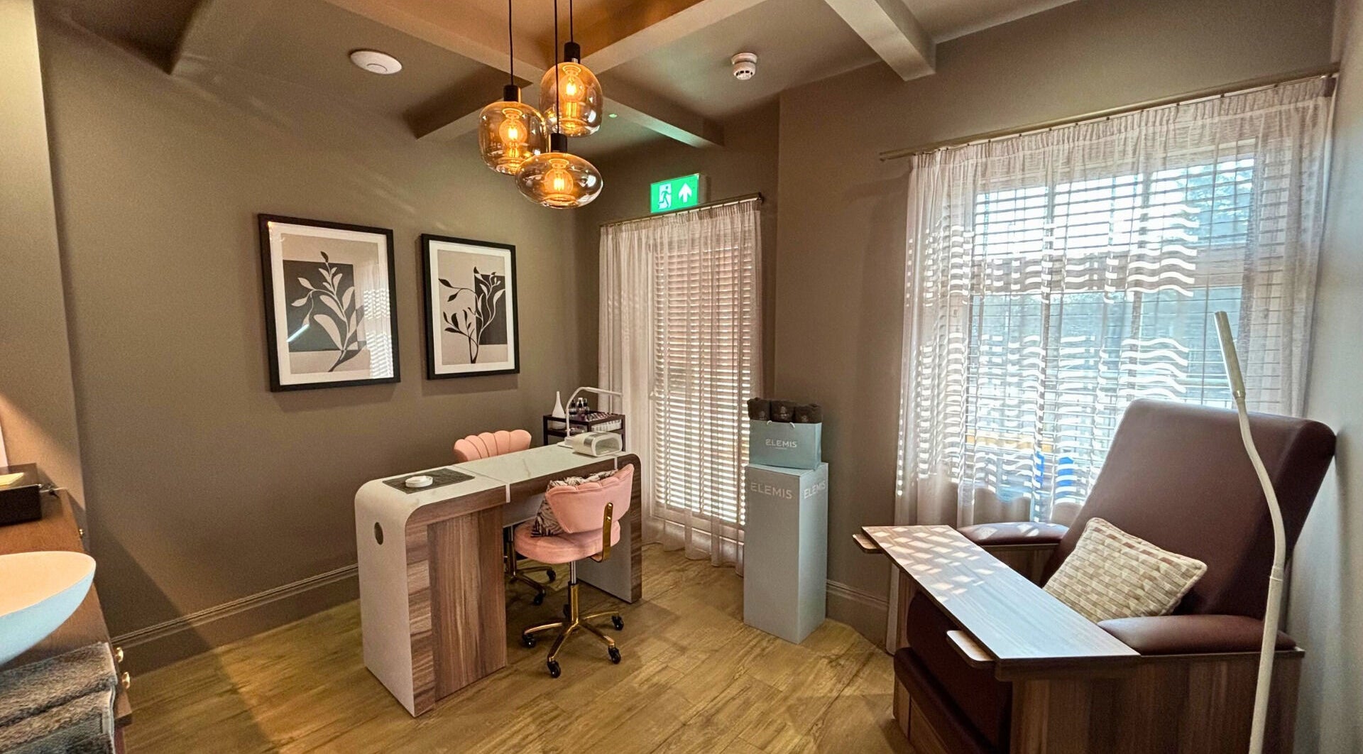 Cozy nail station at The Hillbrook, Sherborne, England, GB, featuring chic chairs and warm lighting.