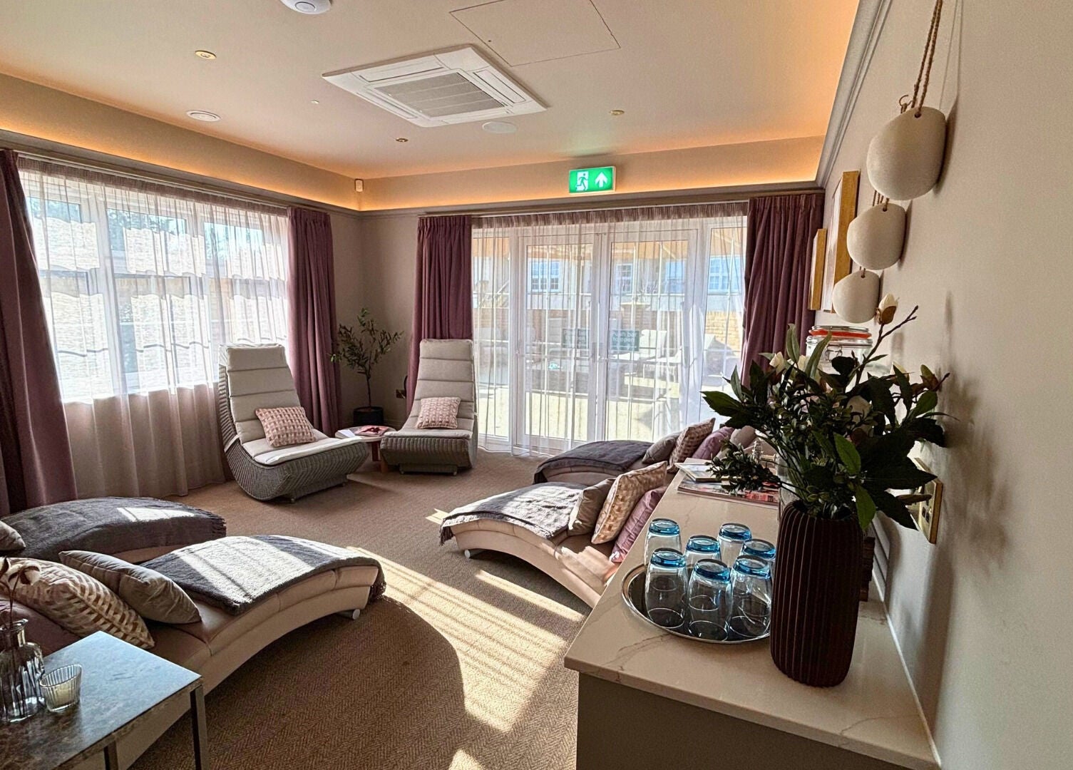 Relaxation lounge at The Hillbrook, Sherborne, England, GB, with plush loungers and ambient lighting.