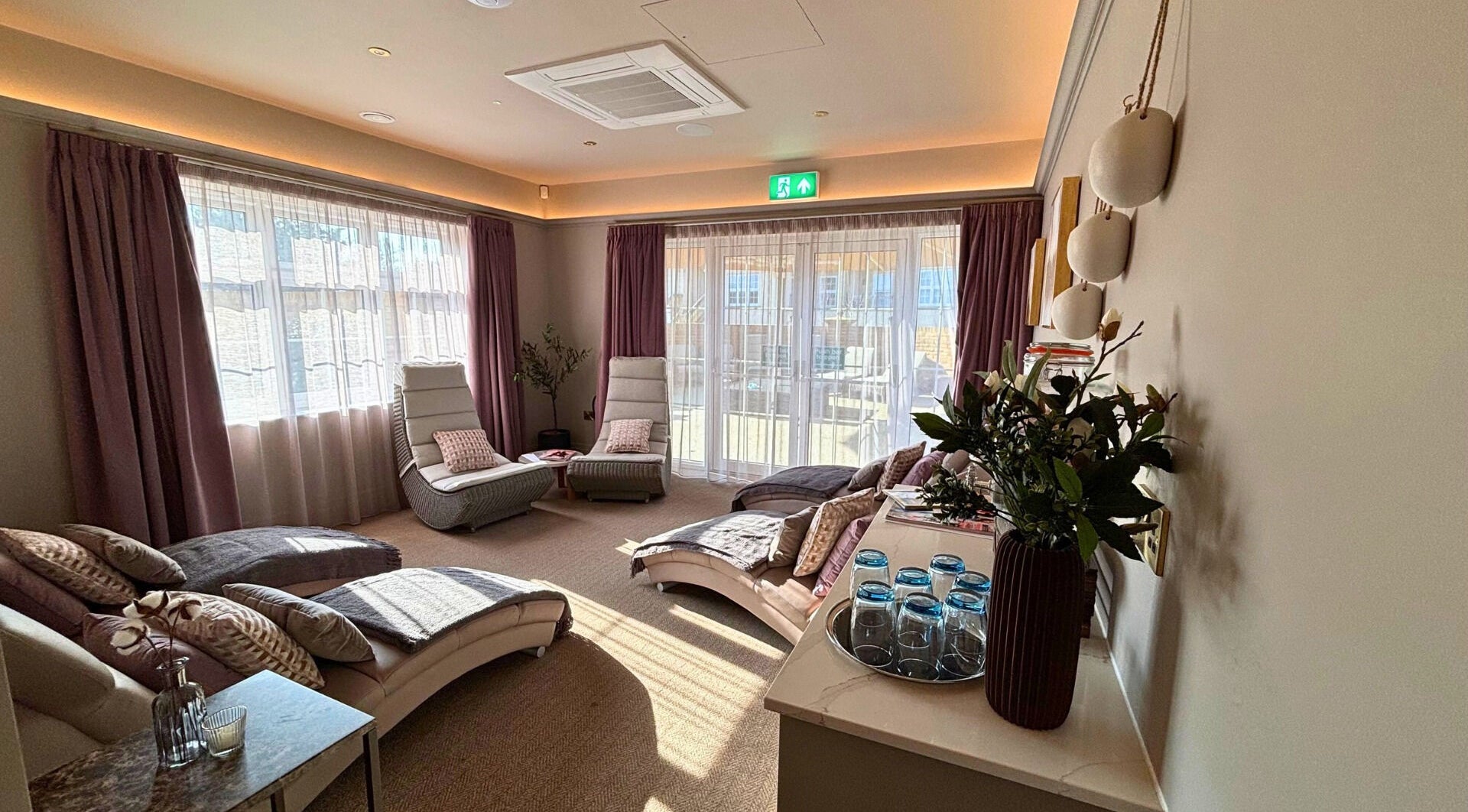 Relaxation lounge at The Hillbrook, Sherborne, England, GB, with plush loungers and ambient lighting.