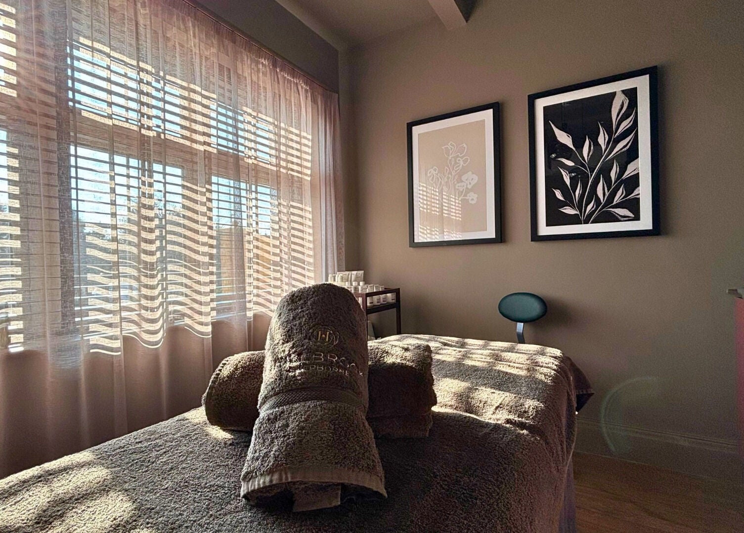 Relaxing massage room at The Hillbrook, Sherborne, England, GB featuring elegant decor and soft natural light.