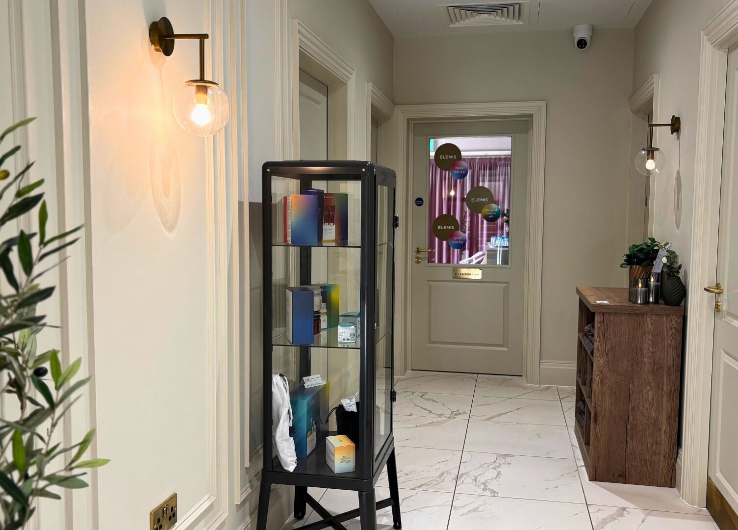 Bright hallway at The Hillbrook, Sherborne, England, GB with modern décor and beauty products on display.