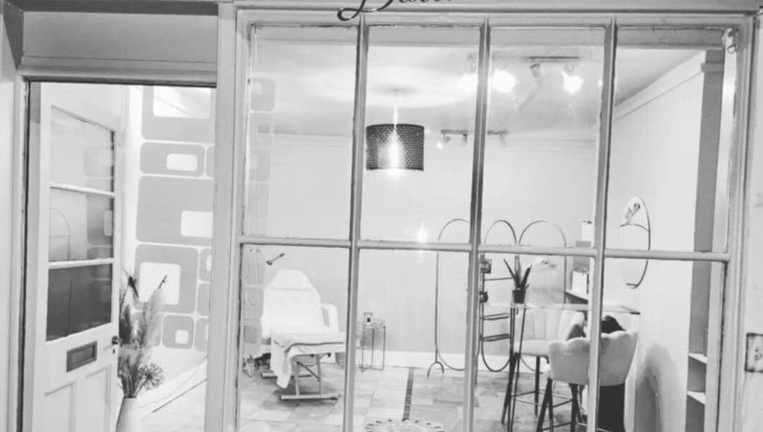 Front view of Bespoke Body Sculpting's elegant interior in Bath, England, GB, featuring modern decor and a plush chair.