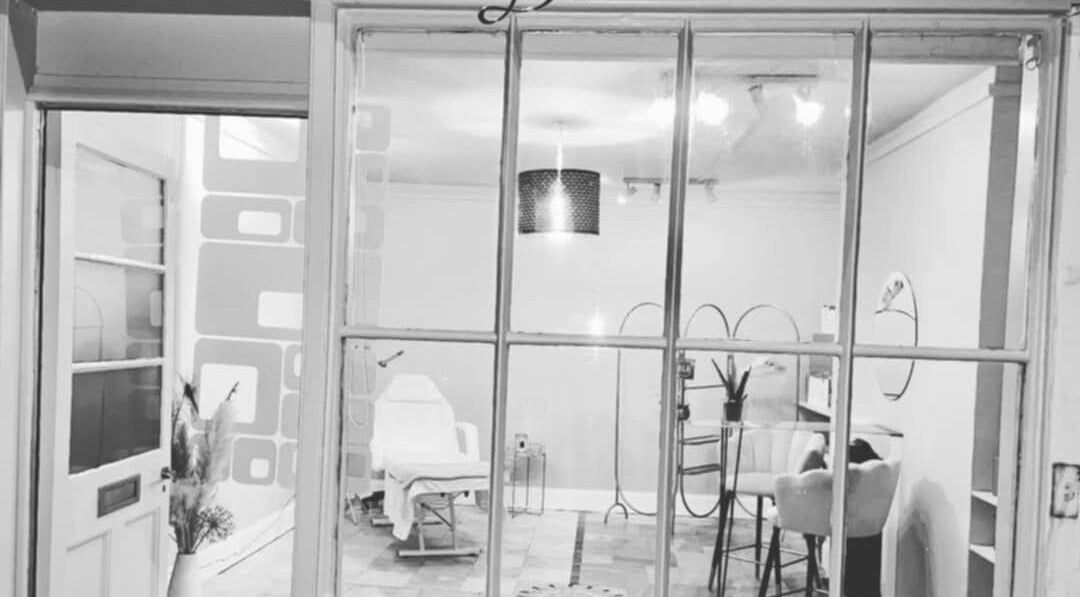 Front view of Bespoke Body Sculpting's elegant interior in Bath, England, GB, featuring modern decor and a plush chair.