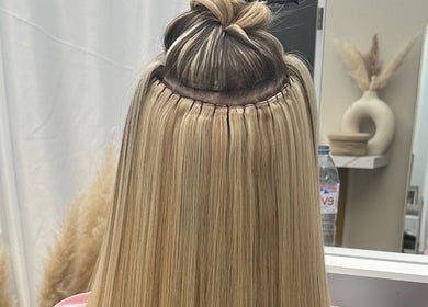 Hair extensions at HairByElizabeth, London, England, GB, showcasing expert hairstyling.