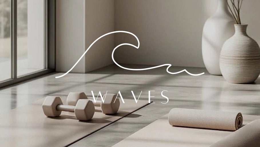 Serene yoga space at W A V E S in Kralendijk, Bonaire, BQ, featuring yoga mats and dumbbells amid natural light.
