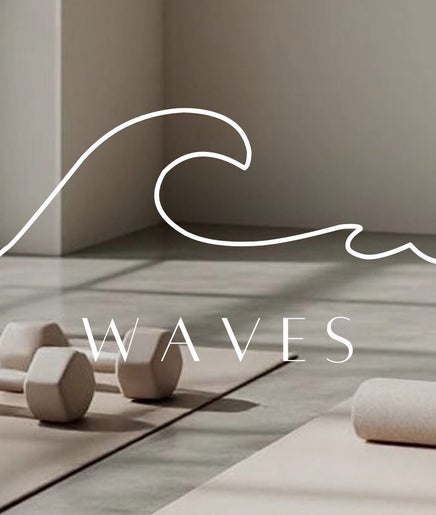 Serene yoga space at W A V E S in Kralendijk, Bonaire, BQ, featuring yoga mats and dumbbells amid natural light.