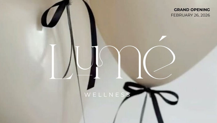 Grand opening decor of LUMÉ in Kralendijk, Bonaire, featuring elegant white balloons with black ribbons.