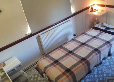 Tranquil therapy room at HEBS - Forden, Welshpool, Kingswood, Forden, Wales, GB with cozy massage table.