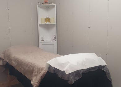 Peaceful massage room at HEBS - Forden, Welshpool, located in Kingswood, Forden, Wales, GB, featuring a cozy treatment bed.