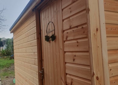 Wooden cabin entrance at HEBS - Forden, Welshpool, Kingswood, Forden, Wales, GB welcoming visitors.