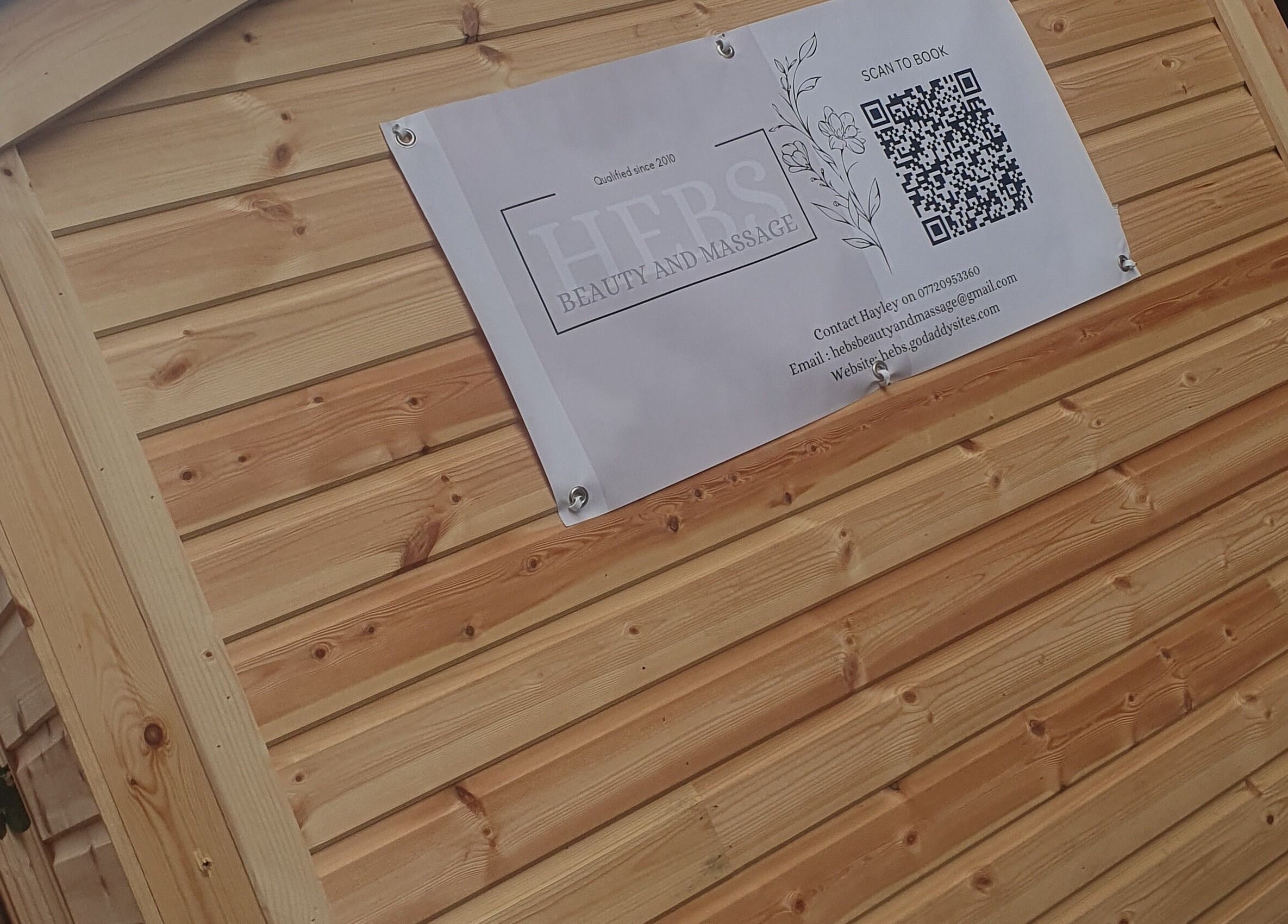 HEBS - Forden, Welshpool wooden sign at Kingswood, Forden, Wales, GB, showcasing beauty and massage services.