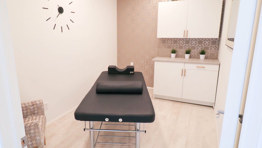 Cozy treatment room at Beautiful You Spa & Lash Boutique in Tillsonburg, Ontario, CA, featuring a modern bed.
