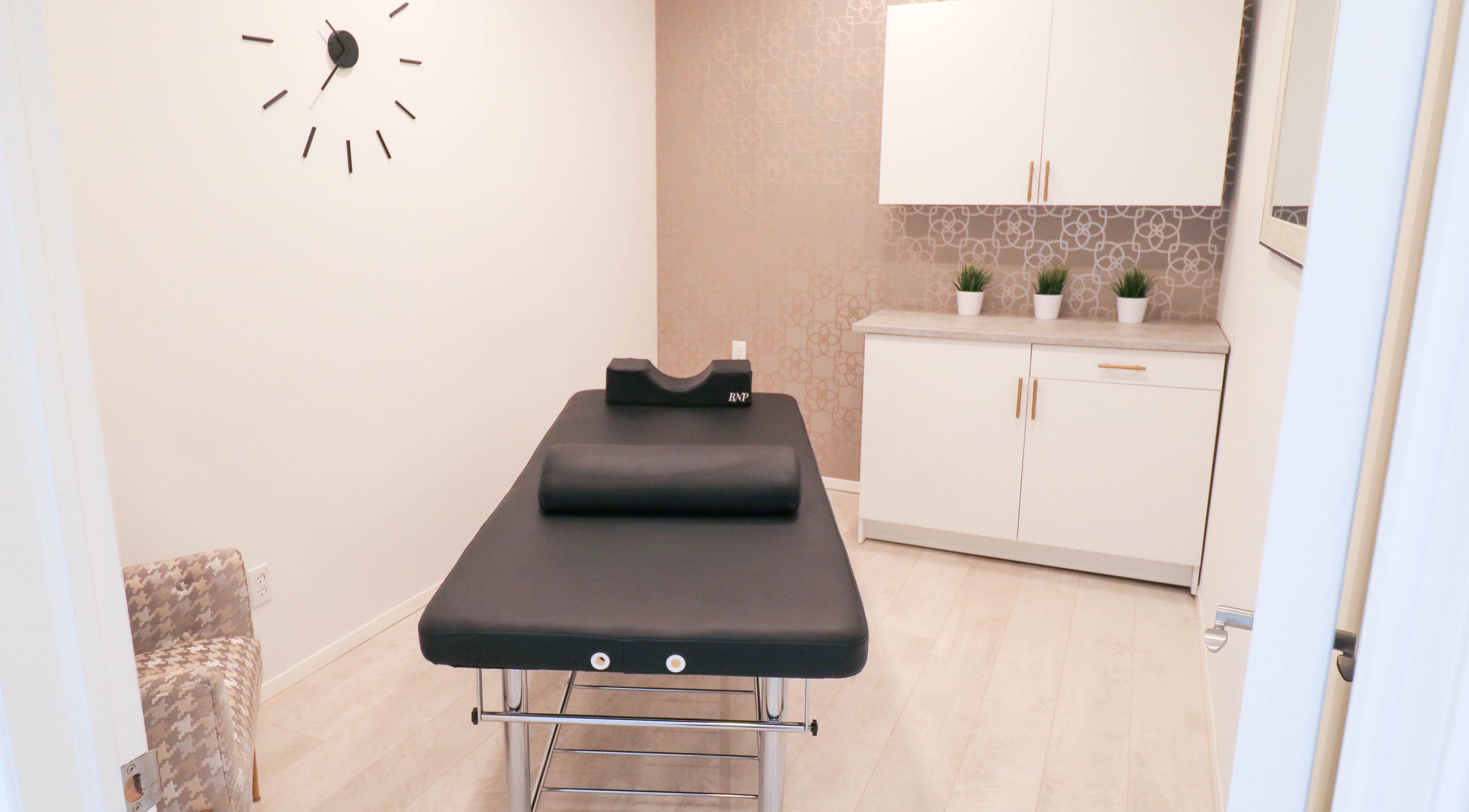 Cozy treatment room at Beautiful You Spa & Lash Boutique in Tillsonburg, Ontario, CA, featuring a modern bed.