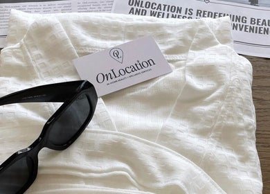 Essentials for OnLocation - Verve Aspen Woods at Calgary, Alberta, CA: sunglasses, white fabric, business card.