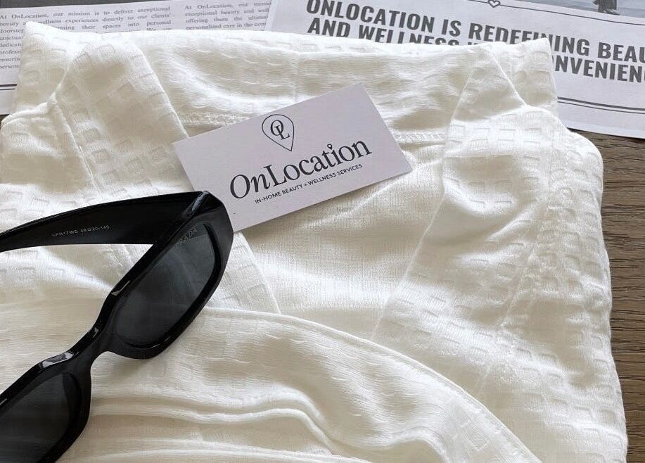 Essentials for OnLocation - Verve Aspen Woods at Calgary, Alberta, CA: sunglasses, white fabric, business card.