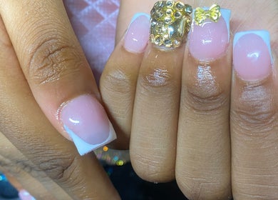 Elegant nail art featuring gems at Naileditby_des, Paulsboro, New Jersey, US.