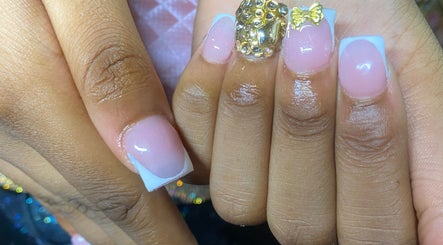 Elegant nail art featuring gems at Naileditby_des, Paulsboro, New Jersey, US.