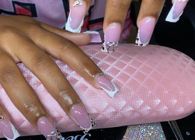 Stylish pink and white nails at Naileditby_des, Paulsboro, New Jersey, US, showcasing elegant designs.