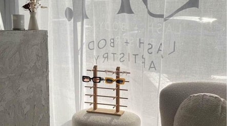 Elegant interior view at SN Lash Artistry, Fairy Meadow, New South Wales, AU, with sunglasses on display.
