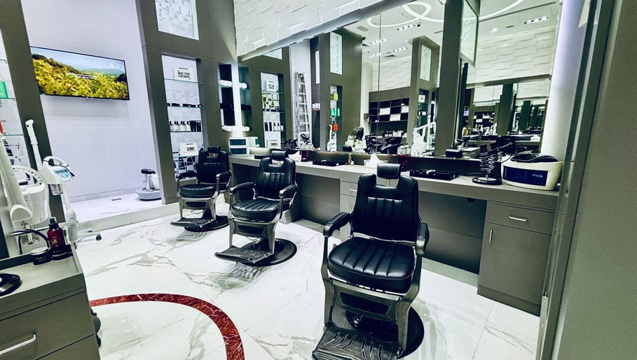 Modern barber chairs at Big City Barbershop, Dubai, AE, showcasing sleek design and elegance.