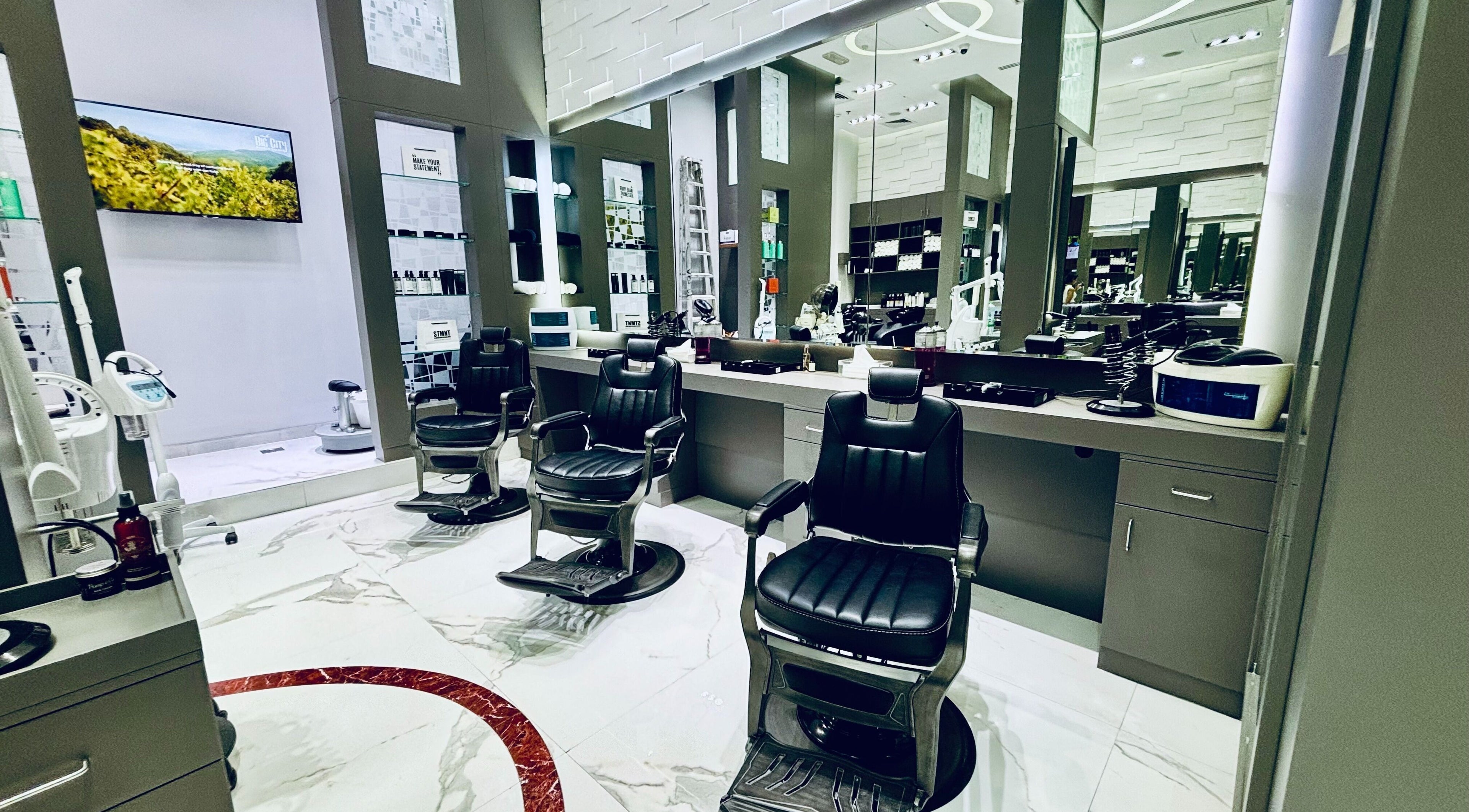 Modern barber chairs at Big City Barbershop, Dubai, AE, showcasing sleek design and elegance.