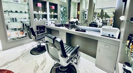 Sleek barber chairs at Big City Barbershop in Dubai, Dubai, AE with stylish reflective mirrors and shelves.