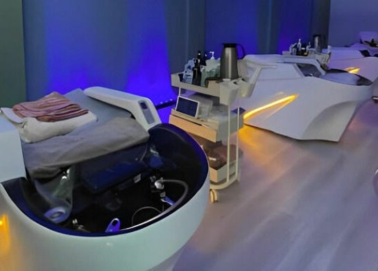 Relaxing spa beds in Am Perfect Spa, Aurora, Illinois, US, with ambient lighting and modern design.