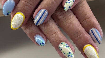 Vibrant lemon-themed nail art at Skinngleam Esthetics, Boca Raton, Florida, US.
