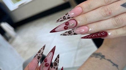 Artistic nail design with cherries at ELLITE TANNING AESTHETICS & BEAUTY BAR, Sheffield, England, GB.