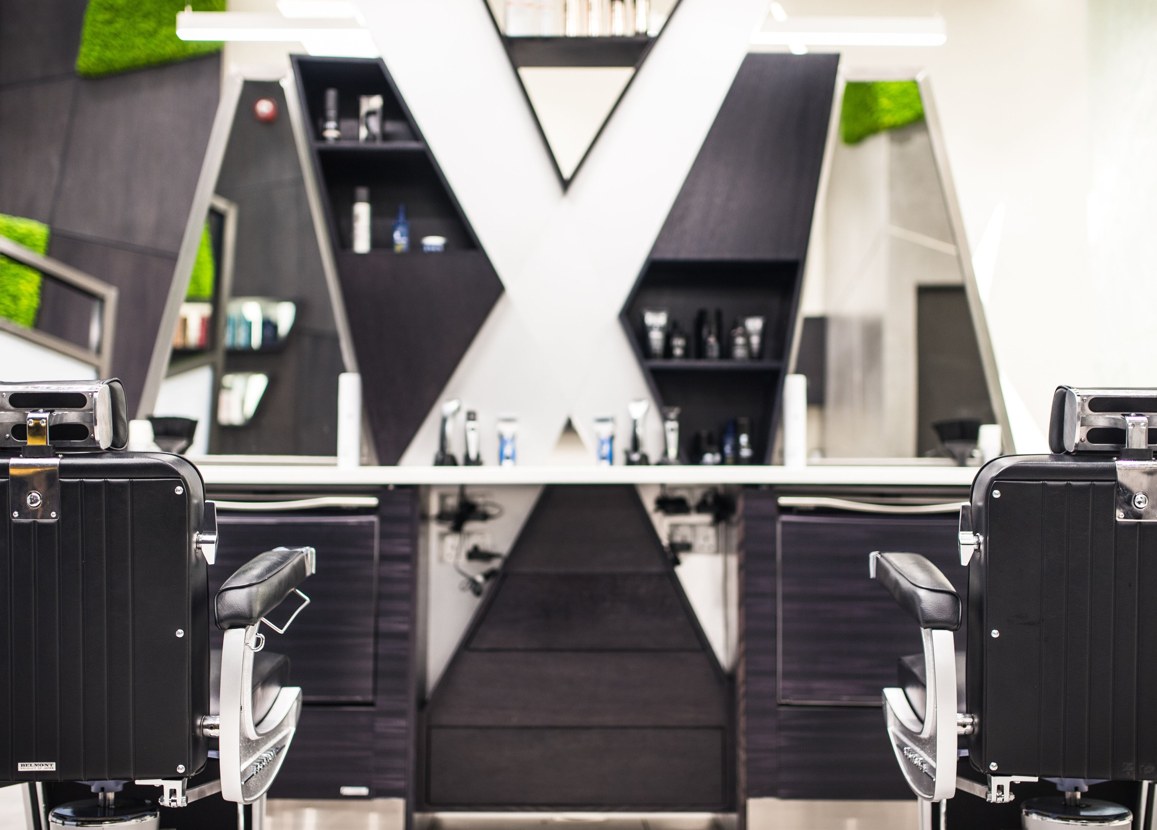 Contemporary salon chairs at X Hair Lounge - City Center Mirdif, Dubai, AE. Modern styling with premium products.