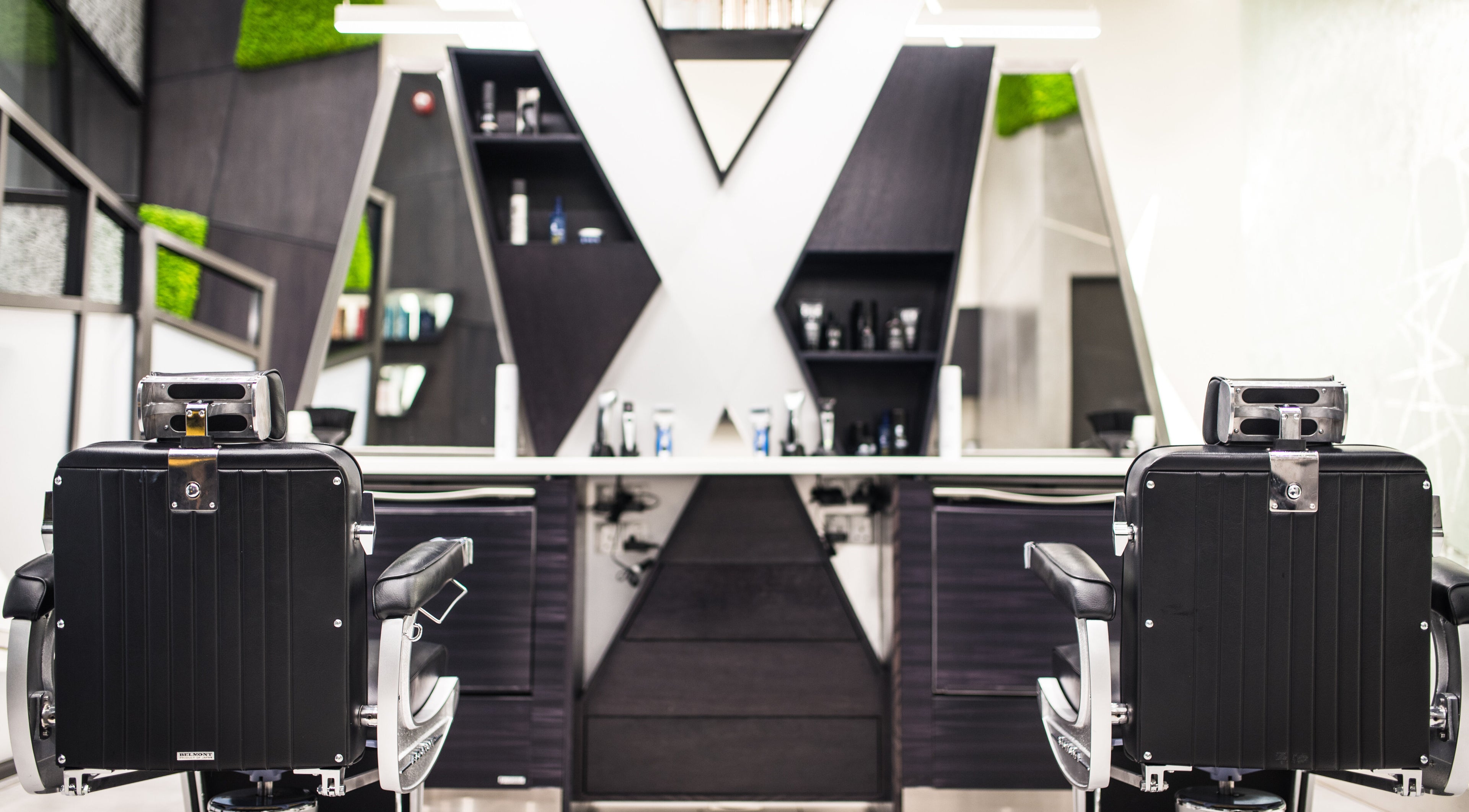 Contemporary salon chairs at X Hair Lounge - City Center Mirdif, Dubai, AE. Modern styling with premium products.